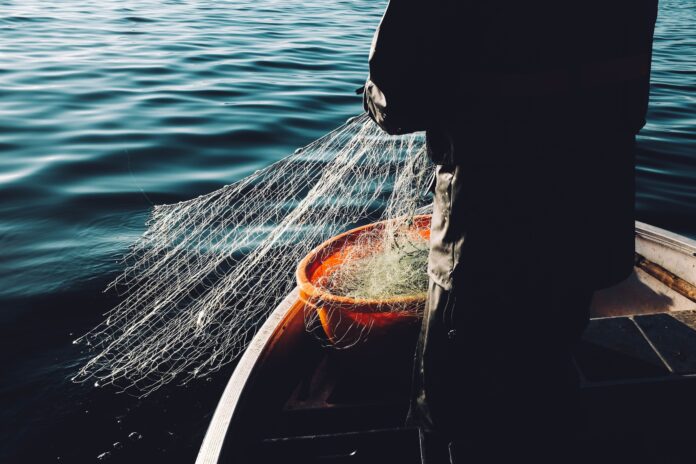 man holding a fishnet