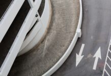 aerial photography of road with arrow signs