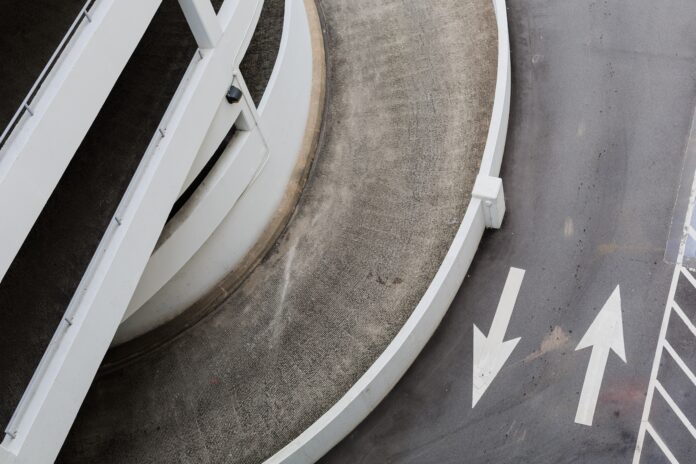 aerial photography of road with arrow signs