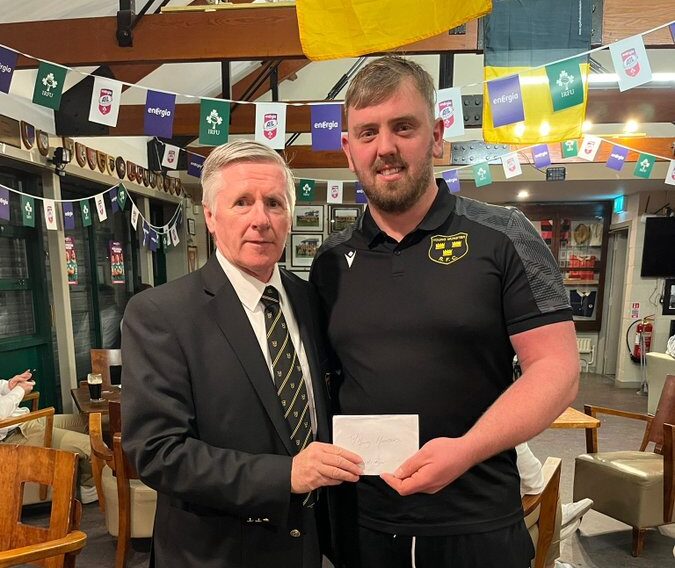 Young Munster President Mick Moore presenting David Begley with his Player of the Game award.