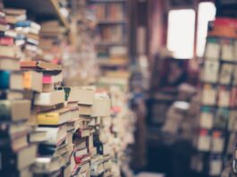 assorted books in shallow focus photography