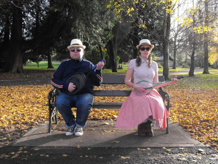 Fred and Alice Guitars sitting on Park Bench