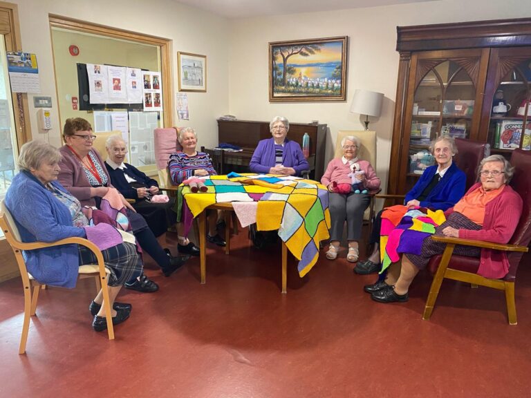 McAuley House ladies knitting rainbows to keep the cold at bay